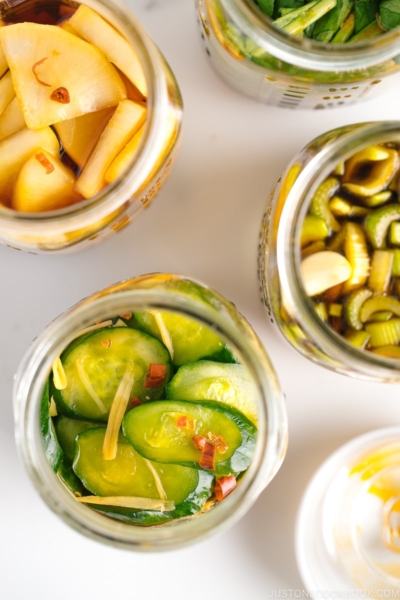 4 Mason jars, each filled with a different soy sauce pickles.