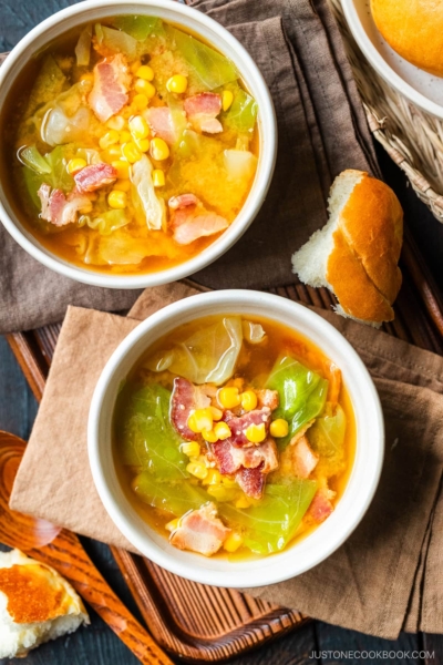 White ceramic bowls containing Bacon and Corn Miso Soup.