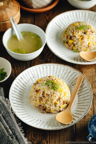 Chashu fried rice served on white plates.