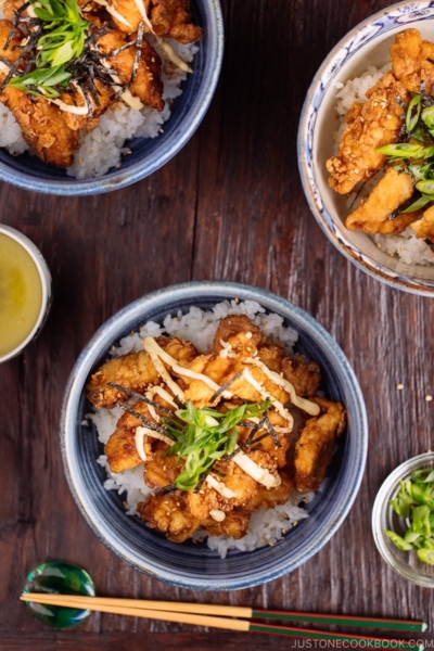 Chinese-style Chicken Karaage on a bed of steamed rice, topped with shredded nori and green onion.