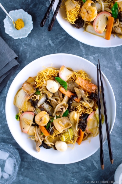 A white bowl containing Crispy Noodles with Seafood (Sara Udon).