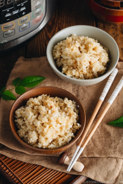 Rice bowls containing perfectly cooked short grain brown rice.