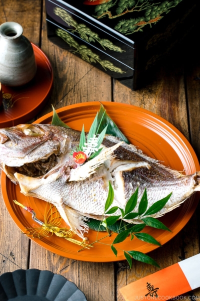 A lacquer tray containing a whole Japanese Baked Sea Bream.