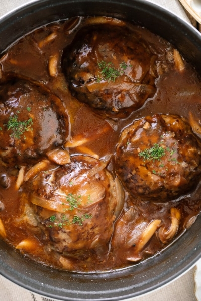 A white staub containing Japanese Stewed Hamburger Steak (Nikomi Hambagu).