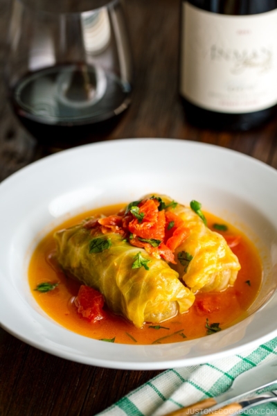 White bowl containing Japanese-style stuffed cabbage rolls.