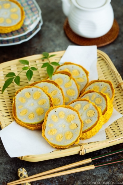 Karashi Renkon - deep fried lotus root stuffed with Japanese hot mustard miso on a bamboo basket.