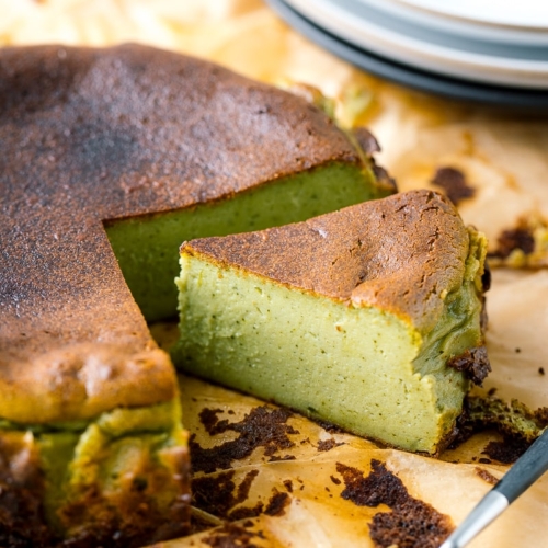 A Matcha Basque Burnt Cheesecake on top of the parchment paper.