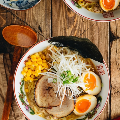 Miso ramen with homemade chashu and ramen egg garnished with nori.