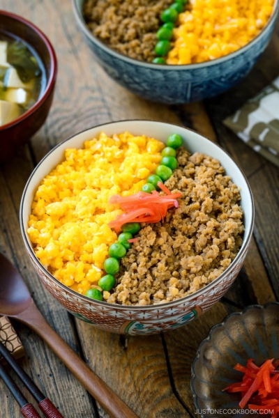 A bowl containing Soboro Don (seasoned ground chicken and scrambled egg over rice).