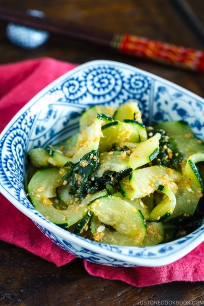 A blue dish containing Spiralized Cucumber Salad.