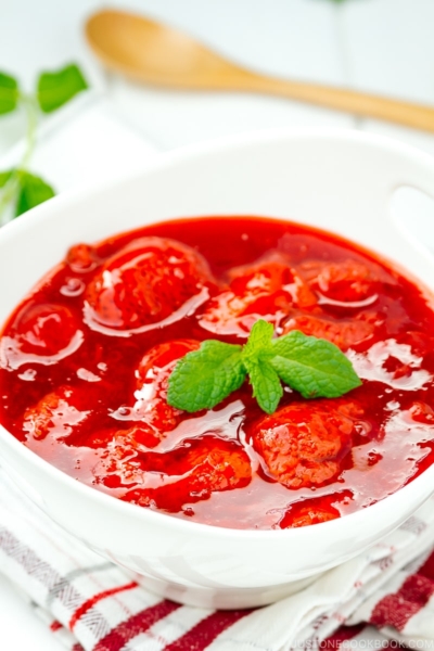 A white bowl containing homemade Strawberry Sauce (Strawberry Compote).