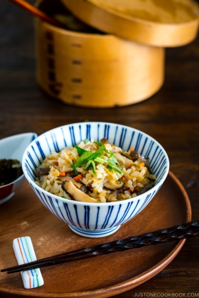 A Japanese blue and white rice bowl containing Takikomi Gohan (Mixed Rice).