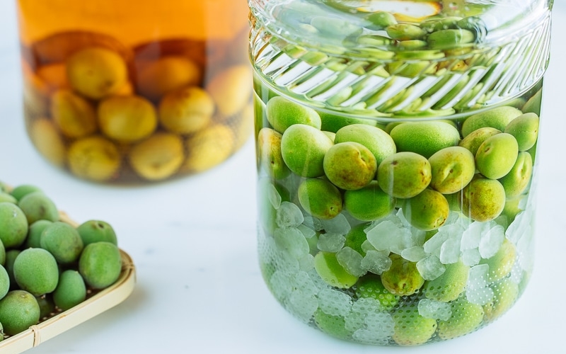 Japanese plum wine (umeshu) in a glass jar.