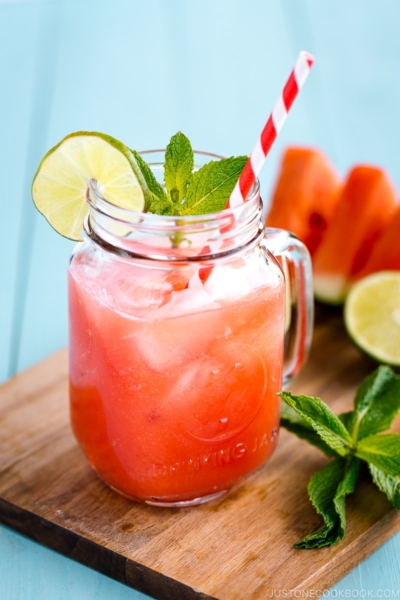 A glass jar containing homemade watermelon juice.