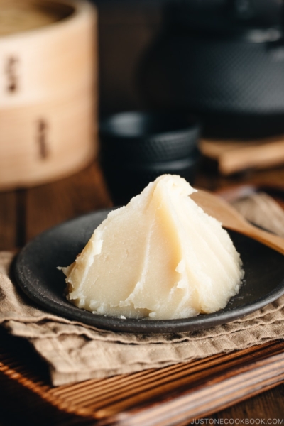 White bean paste on a Japanese black plate.