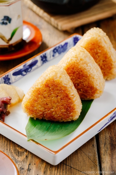 A rectangular plate containing Yaki Onigiri (Grilled Rice Balls).