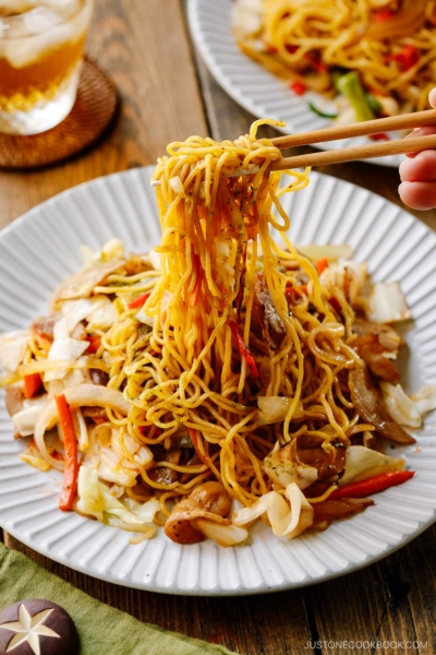 A fluted plate containing Yakisoba (Japanese Stir-Fried Noodles).