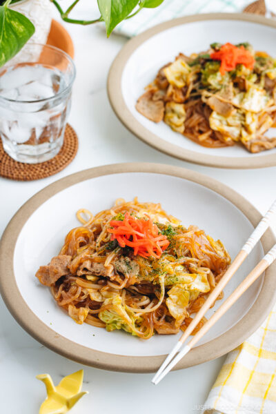 Two plates containing Yakisoba with Malony Glass Noodles.